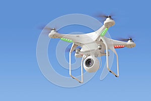Quadcopter drone with camera in blue sky