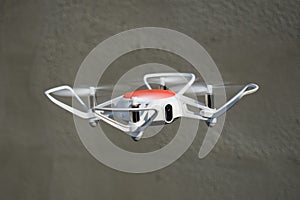 Quadcopter drone in flight with digital camera