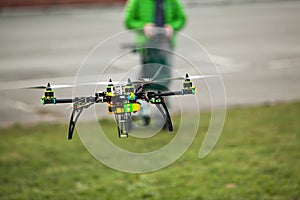 Quadcopter Drone flying in an urban area photo