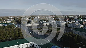 A quadcopter flies over an old Russian city on a beautiful summer day