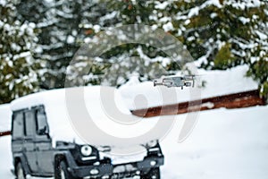 Quadcopter launch in winter snowy forest