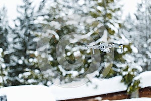 Quadcopter launch in winter snowy forest