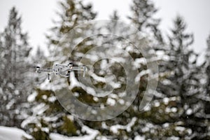 Quadcopter launch in winter snowy forest