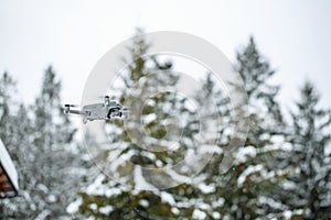 Quadcopter launch in winter snowy forest