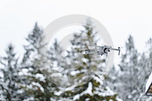 Quadcopter launch in winter snowy forest