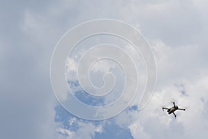 Quadcopter Mavic flies in the sky photo