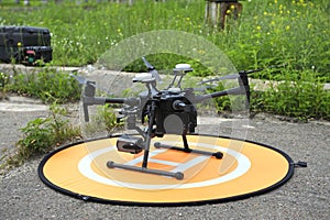 Quadcopter placed on landing pad before launching