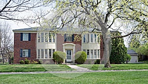 Quadplex Red Brick Building with Convex Paned Windows