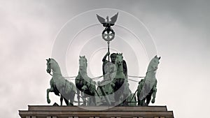Quadriga, the goddess of victory driving a chariot pulled by four horses, on top of The Brandenburg Gate, Berlin, Germany