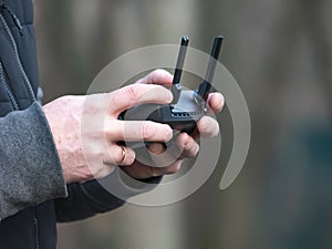 The quadrocopter control panel in the hands of a man