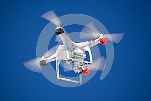 Quadrocopter drone with 4K camera on sky