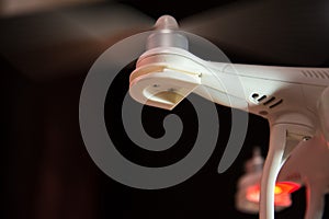 Quadrocopter propeller hums against dark background