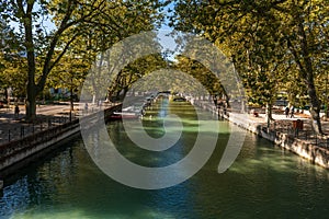 Quai Jules Philippe, a canal in the shade of plane trees, on Lake Annecy, in Haute Savoie, France