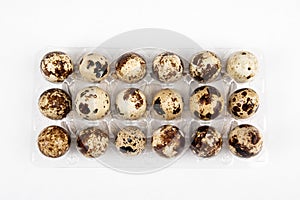 Quail egg pack on a white background. Healthy, breakfast and poultry concept