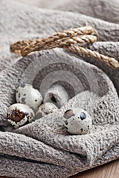 Quail eggs on homespun fabric
