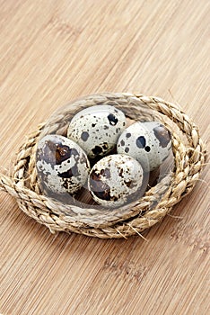 Quail eggs in the nest of hemp rope