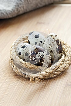 Quail eggs in the nest of hemp rope