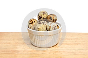 Quail eggs in ramekin