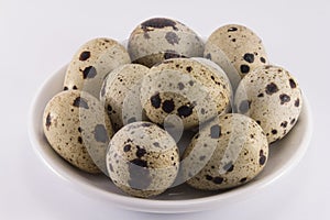 Quail eggs on a saucer