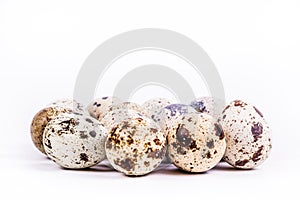 Quail eggs on white background. Healthy foods.