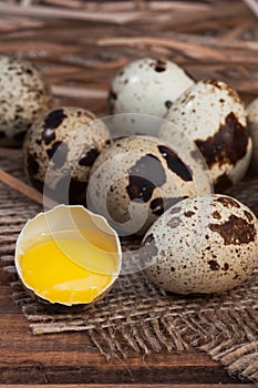 Quail eggs on wooden background close-up