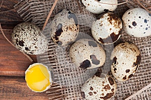 Quail eggs on wooden background close-up