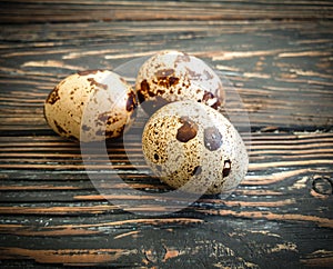 Quail eggs on wooden background easter, fragility