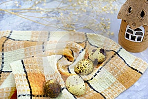 Quail eggs on wooden background. Happy Easter