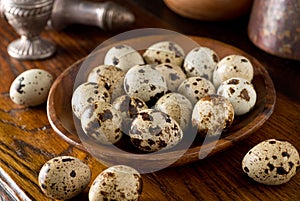 Quail Eggs in a Wooden Bowl