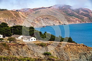 Quaint homes on cliffside hills overlooking bay of water photo