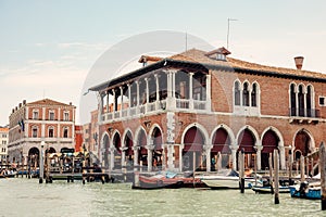 Quaint marketplace with an array of fruits and vegetables, located alongside Venice\'s majestic Grand Canal photo