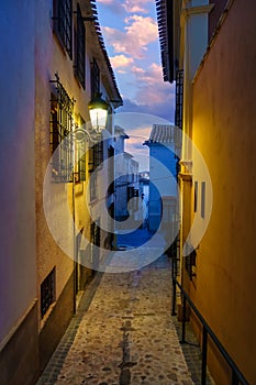 Quaint narrow alley at dusk in the Andalusian village of Velez Rubio, Almeria, Spain. photo