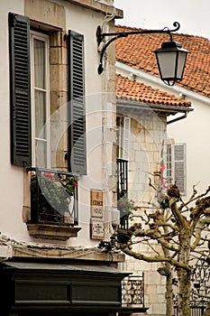 Quaint, old-fashioned houses with balconies in Saint Jean de Luz, France photo