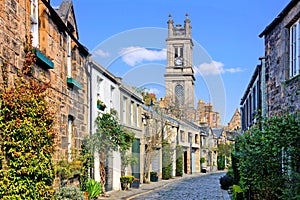 Quaint street with church spire in Edinburgh, Scotland