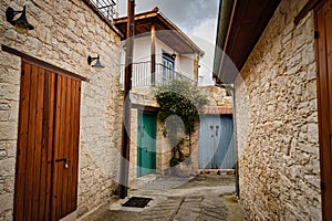an alley with doord homes in a small village in the hills photo