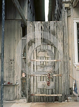 Quaint wooden exterior door weathered by salty ocean air