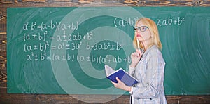 Qualities that make good teacher. Principles can make teaching effective. Woman teaching near chalkboard in classroom