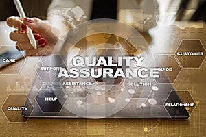 Quality assurance concept on the virtual screen. Business concept.