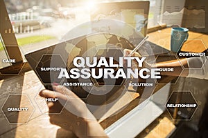 Quality assurance concept on the virtual screen. Business concept