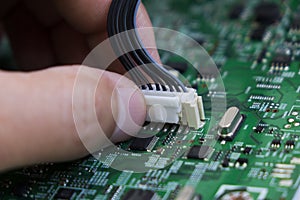 Quality control and assembly of SMT printed components on circuit board photo