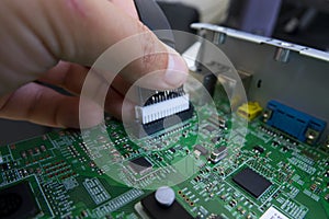 Quality control and assembly of SMT printed components on circuit board photo