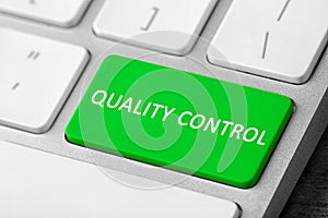 Quality control button on modern computer keyboard