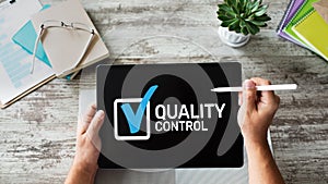 Quality control check box on device screen. Standards and certification, assurance, guarantee. Business concept.