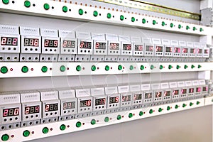 Quality control of electronic devices at the stand. Manufacture of sockets volt control and quality control. Lots of