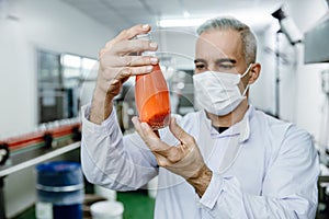 Quality control and food safety inspector test and check product contaminate standard in the food and drink factory production photo