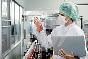Quality control and food safety inspector test and check product contaminate standard in the food and drink factory production