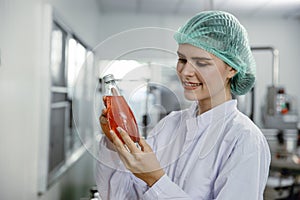 Quality control and food safety inspector test and check product contaminate standard in the food and drink factory production photo