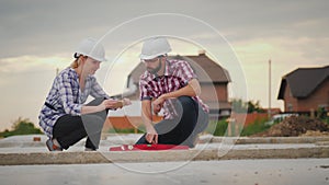 The quality control inspector photographs the readings of the device on the construction site. Quality construction