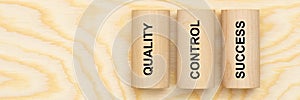 Quality, control and success printed on three pillars