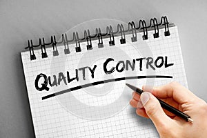 Quality Control text on notepad, business concept background